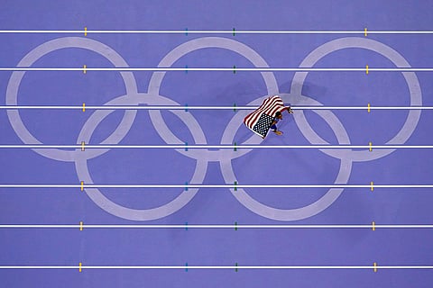 Quincy Hall, of the United States, celebrates after winning men's 400-meter final